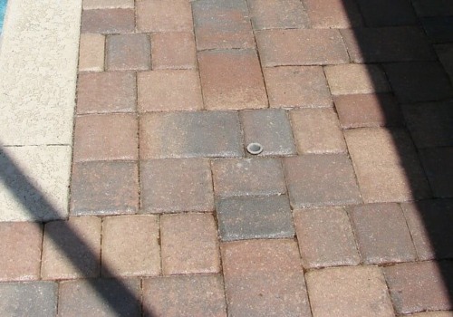 Is it better to spray or roll paver sealer?